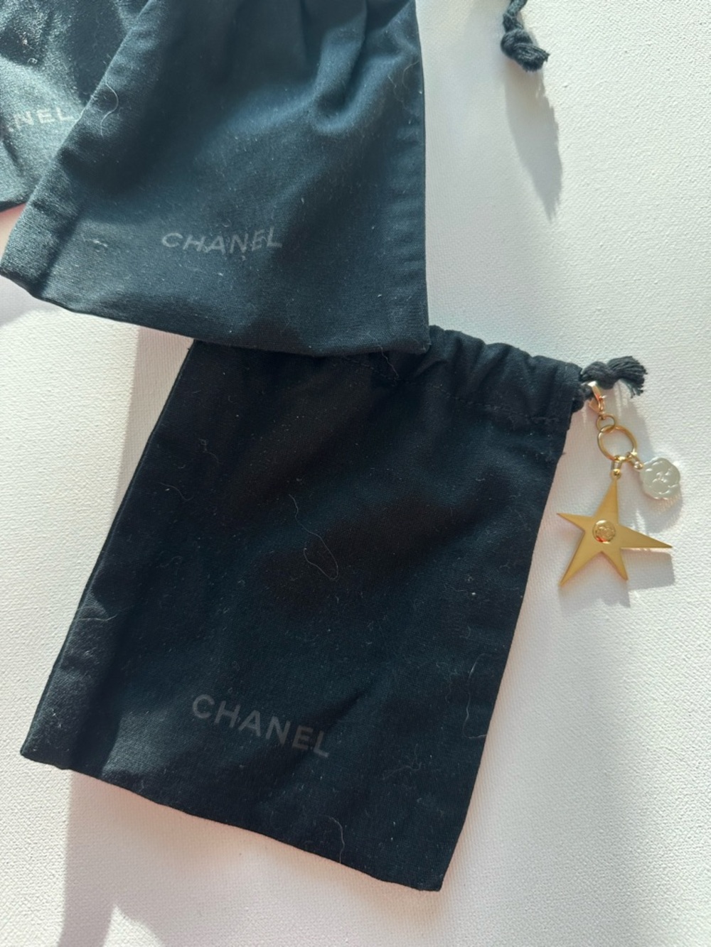 3 CHANEL Black Drawstring Pouches with Gold Star Charm and Logo